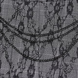 Faltenrock mit Punk-Muster